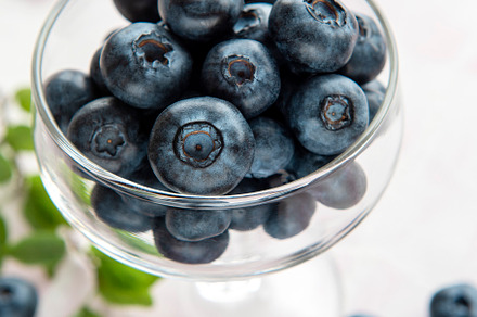 Blueberries on tile background, a Food & Drink Photo by Olena Rudo