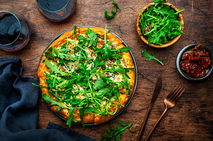 Hot pizza with mozzarella cheese, ham, pesto sauce and fresh aru, a Food & Drink Photo by 5PH