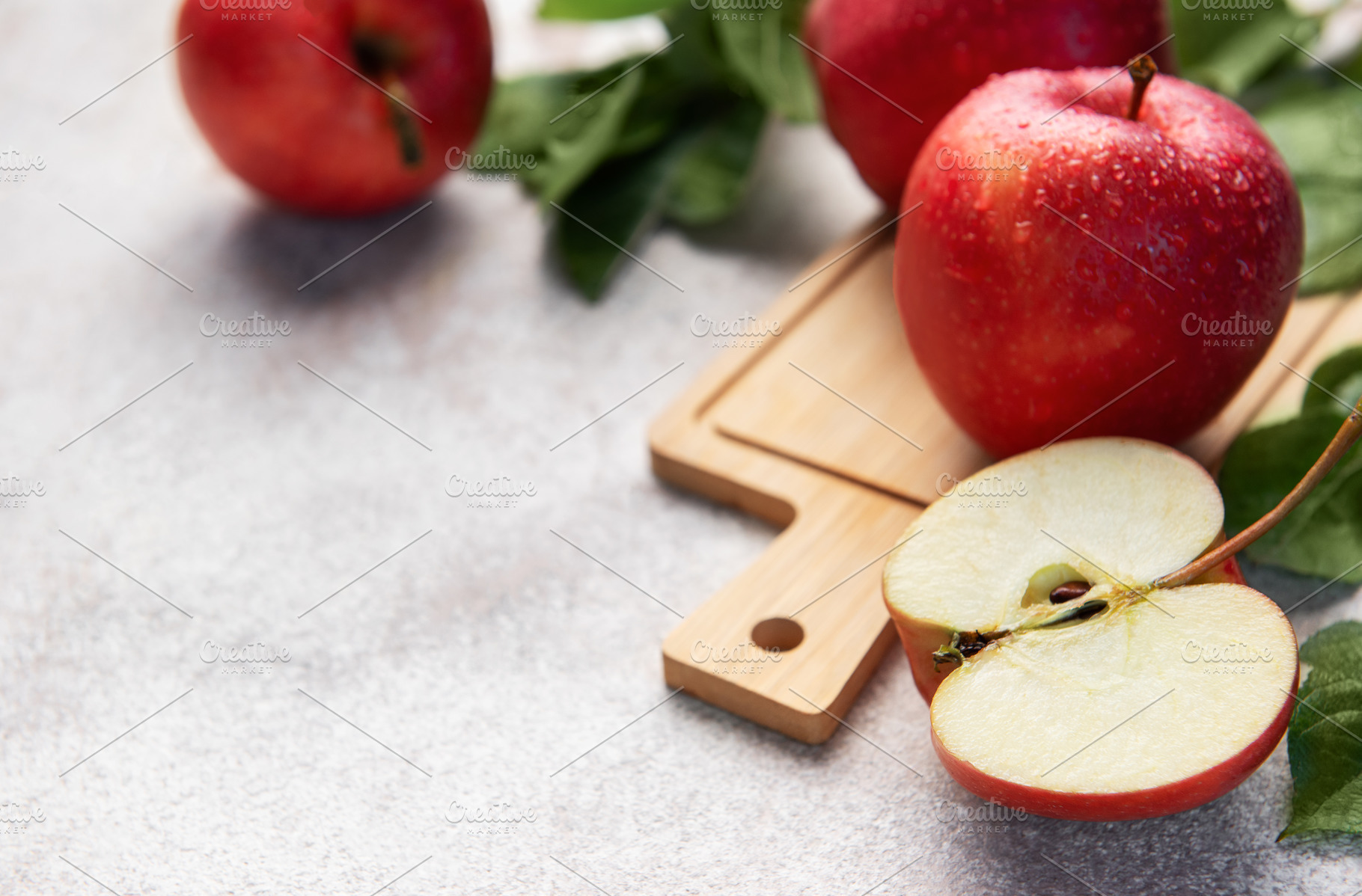Red apples and a cut apple slice, healthy eating, a Food & Drink Photo by Olena Rudo