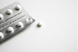 White round tablets scattered on, a Health & Medical Photo by volodymyrshtun13795
