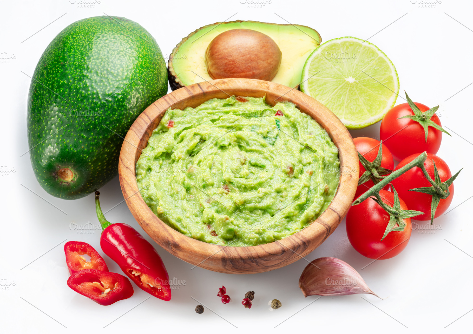 Guacamole bowl and guacamole ingredients isolated on white backg, a Food & Drink Photo by Volff