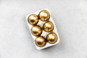 Golden Easter Eggs in Carton on Light Background, a Holiday Photo by Natalia Klenova's Shop