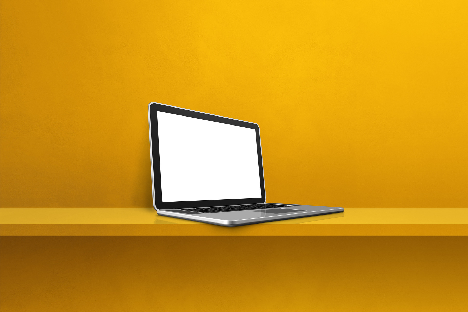 Laptop computer on yellow shelf background, a Technology Photo by GoodGoods