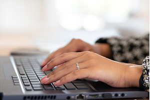Close-up of a womans hands typing on, a School & Education Photo by undrey