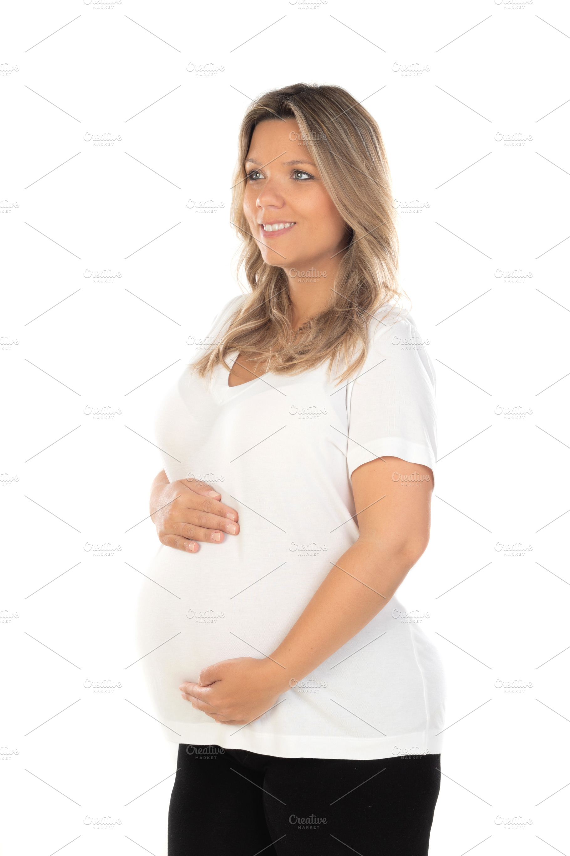 Young beautiful blonde woman pregnant expecting baby over isolat, a Person Photo by José Manuel Gelpi