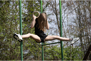 Cute girl doing rings gymnastics, a Sports & Recreation Photo by Nenahliadava Design
