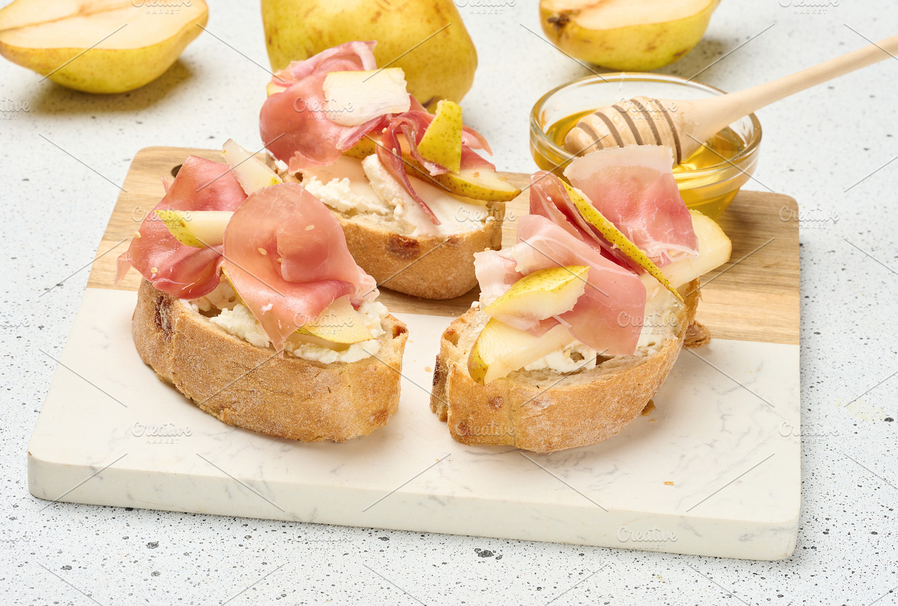 Close up of Italian bruschetta a slice of crusty bread with pros, a Food & Drink Photo by ndanko