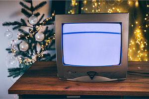 Old TV set in a room with Christmas