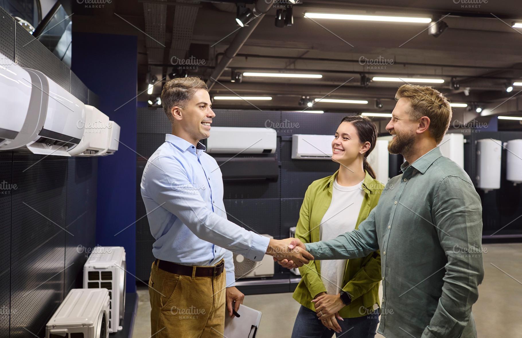 Salesman Shaking Hands with Couple, a Person Photo by StudioRomantic