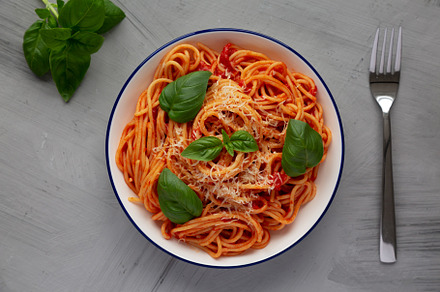 Homemade Pasta Pomodoro on a Plate, top view. Flat lay, overhead, a Food & Drink Photo by LiudmylaChuhunova