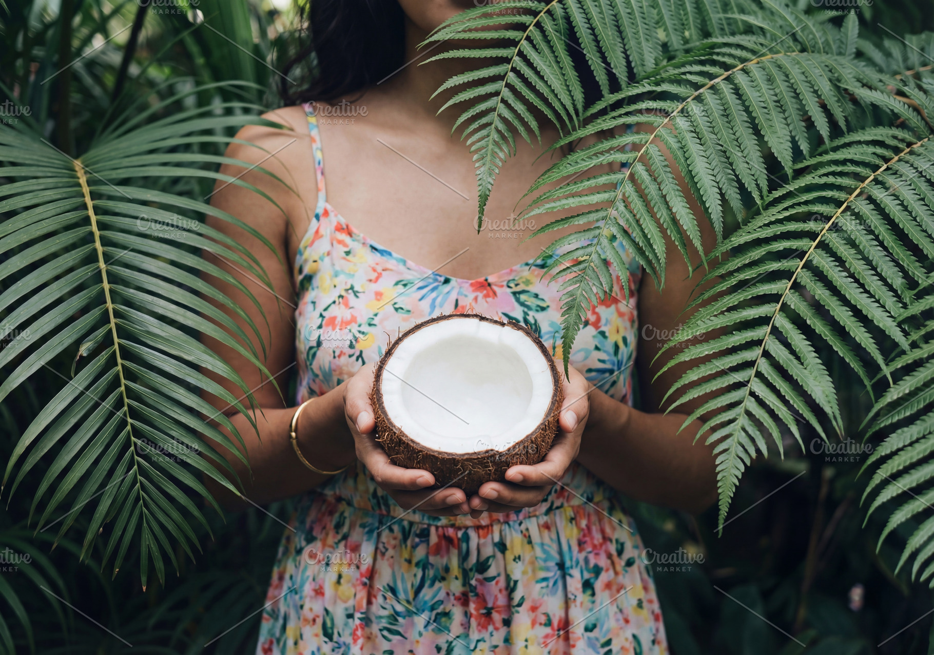 Woman Holding Half a Fresh Coconut, a Beauty & Fashion Photo by Virgo Studio