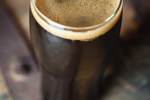 Pint of Stout on a Barrel