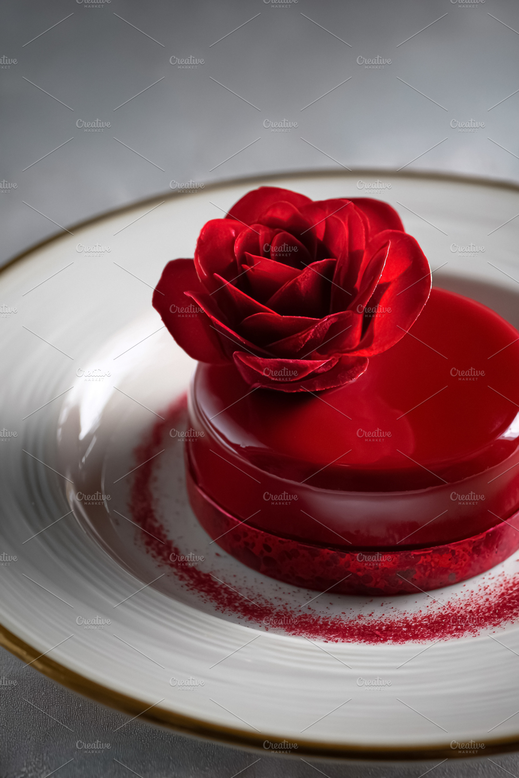 Romantic Valentine's Day dessert with red rose, elegant glazed m, a Photo by Studio ANNA