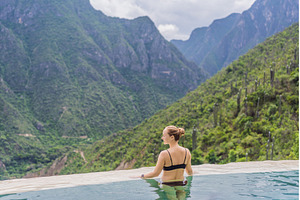 Female tourist exploring Grutas, a Nature Photo by Elizaveta Galitskaya