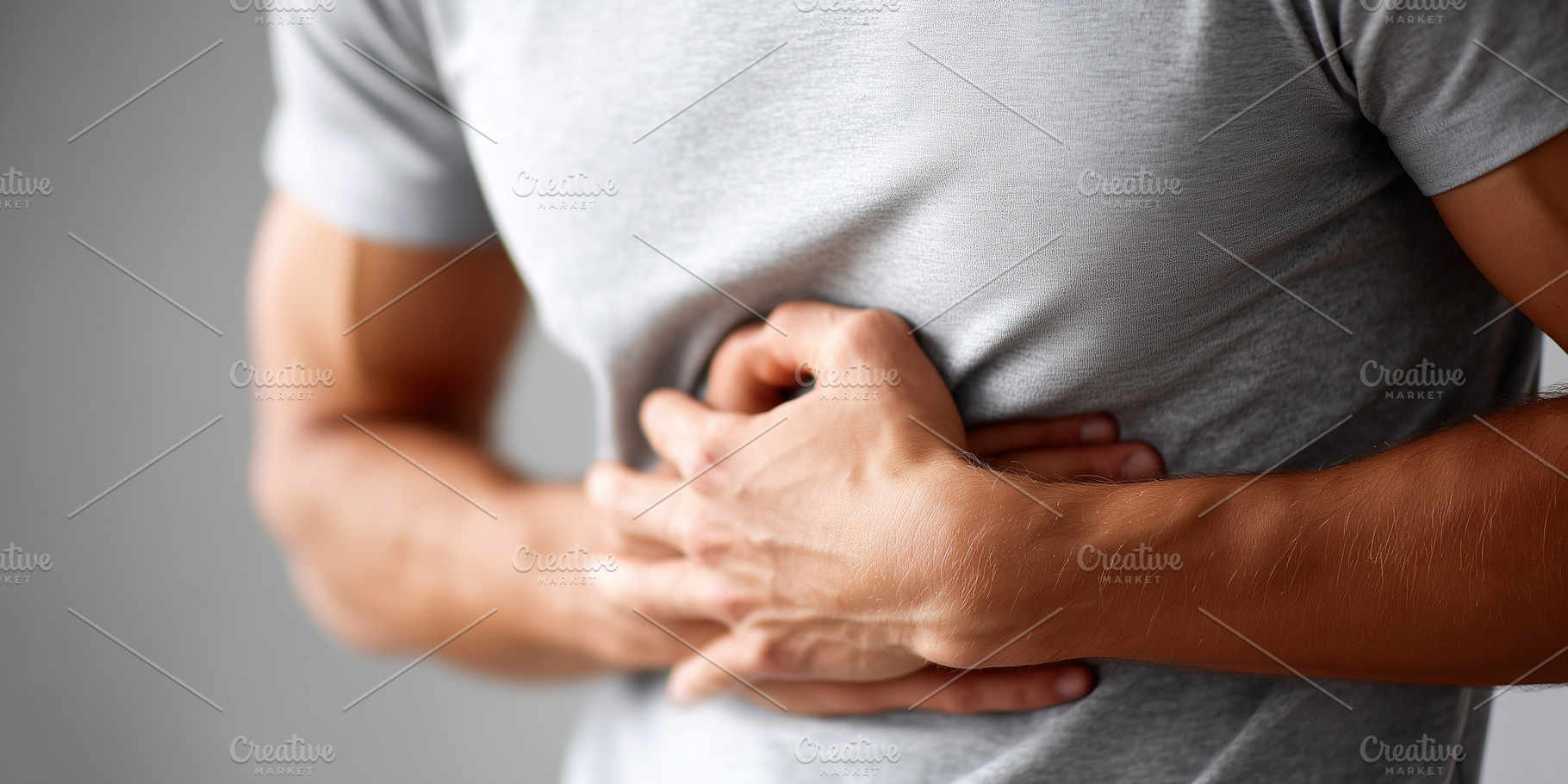 Man experiencing stomach pain, a Health & Medical Photo by MistyDay