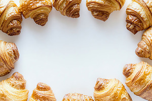 French pastry croissants with copyspace for text, a Food & Drink Photo by AlyaAnd