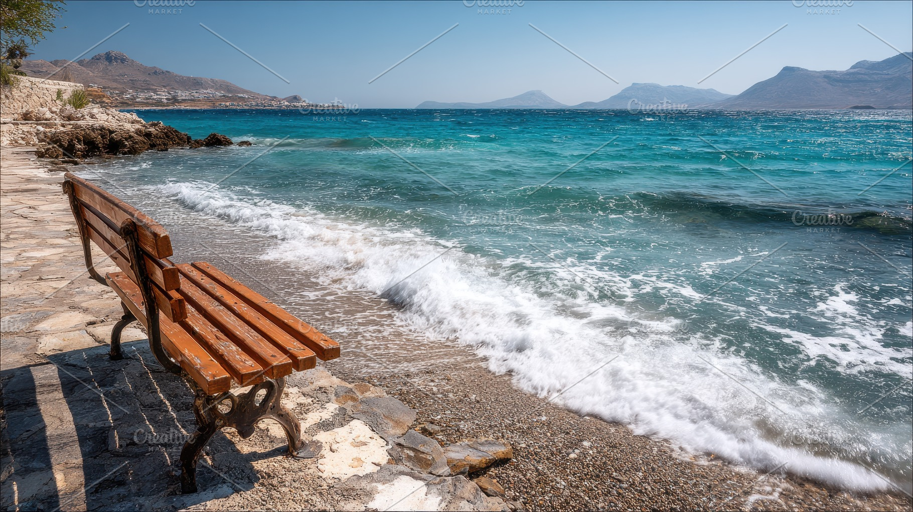 Bench sits on rocky shore, a Photo by Pavel_design