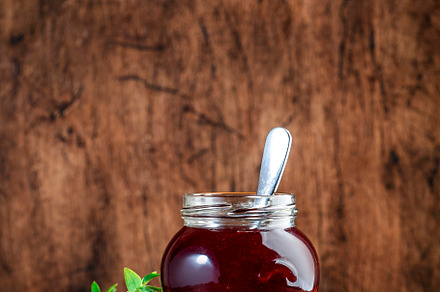 Homemade strawberry jam or confiture in glass jar and fresh berr, a Food & Drink Photo by 5PH