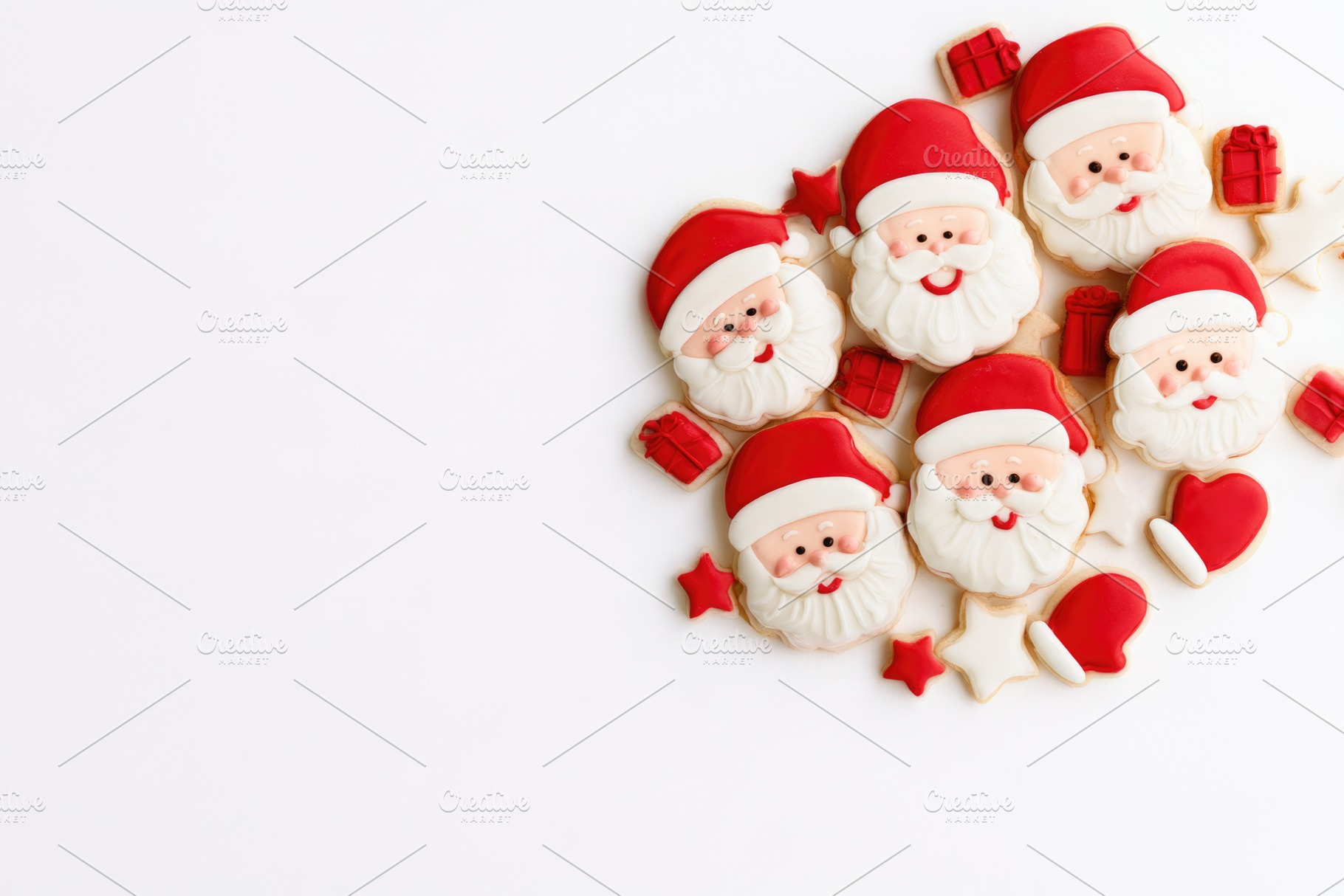 Santa Claus Christmas cookies with gifts and stars on white back, a Food & Drink Photo by José Manuel Gelpi
