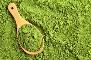 green tea powder top view AI generated, a Photo by WorldOfPhotos