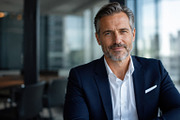 Businessman poses in office setting, a Photo by Beautiful things (Thumbnail 1 of 2)