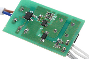 Green electronic board with various components and several wires, a Technology Photo by ndanko