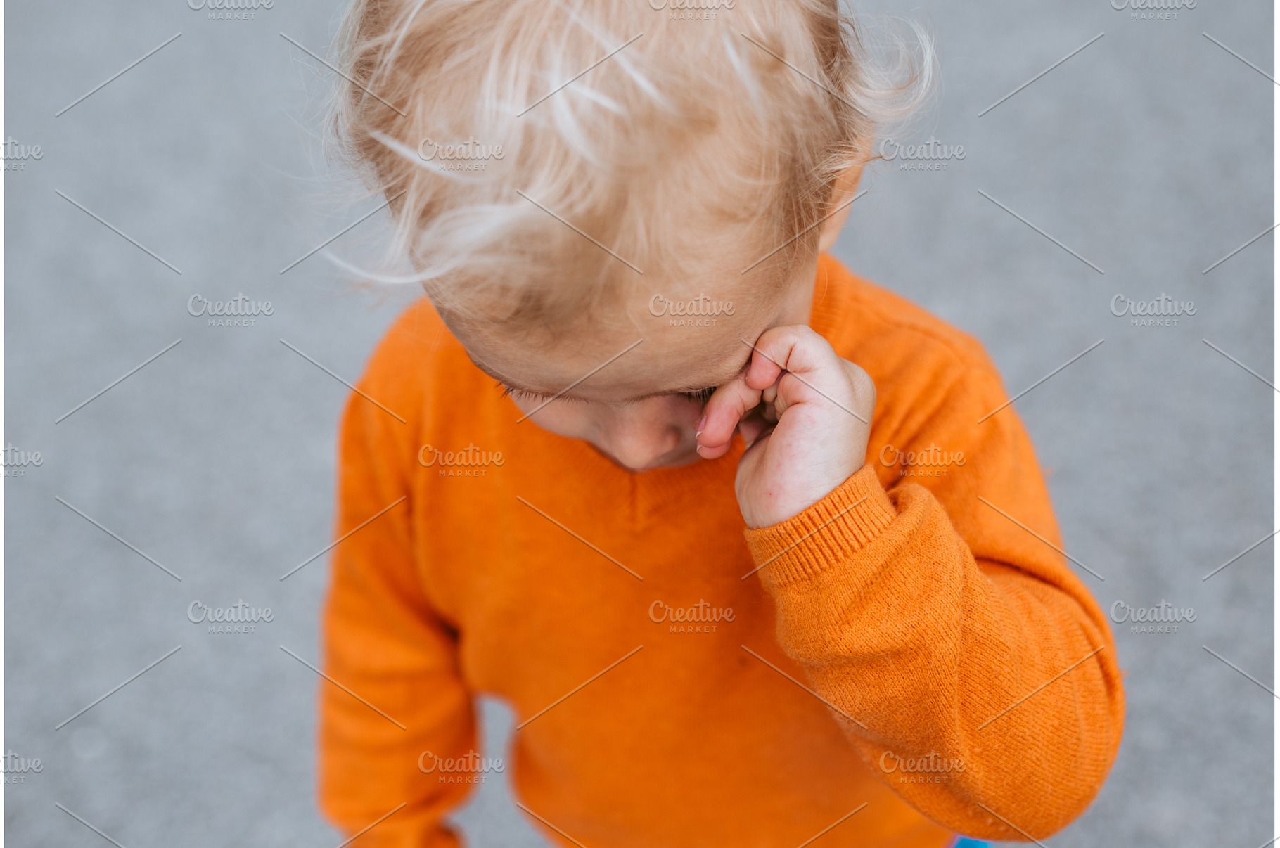 Portrait of a crying toddler boy in, a Nature Photo by HalfPoint