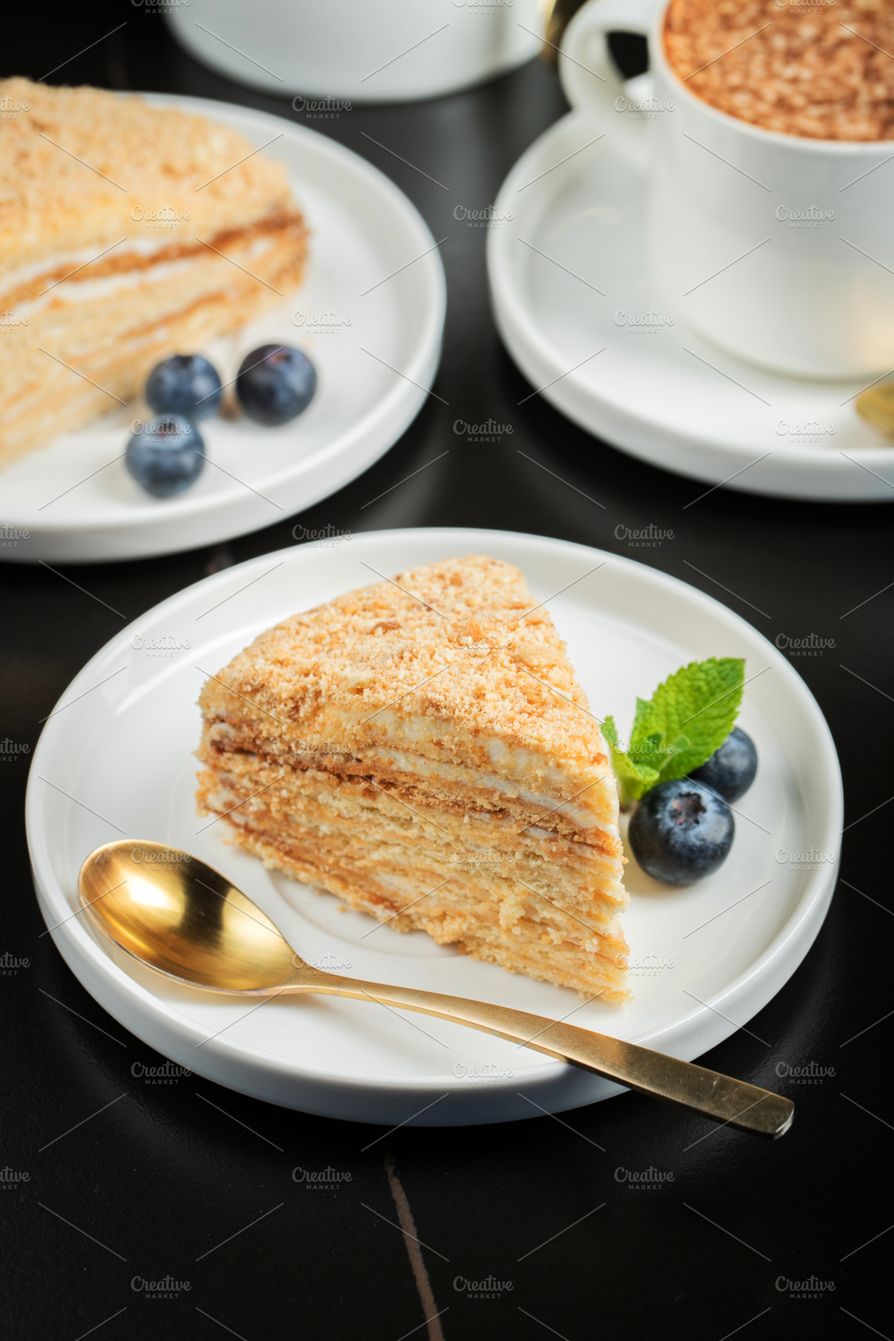 Medovik. Honey cake made from honey cakes with whipped sour crea, a Food & Drink Photo by Budarinphoto