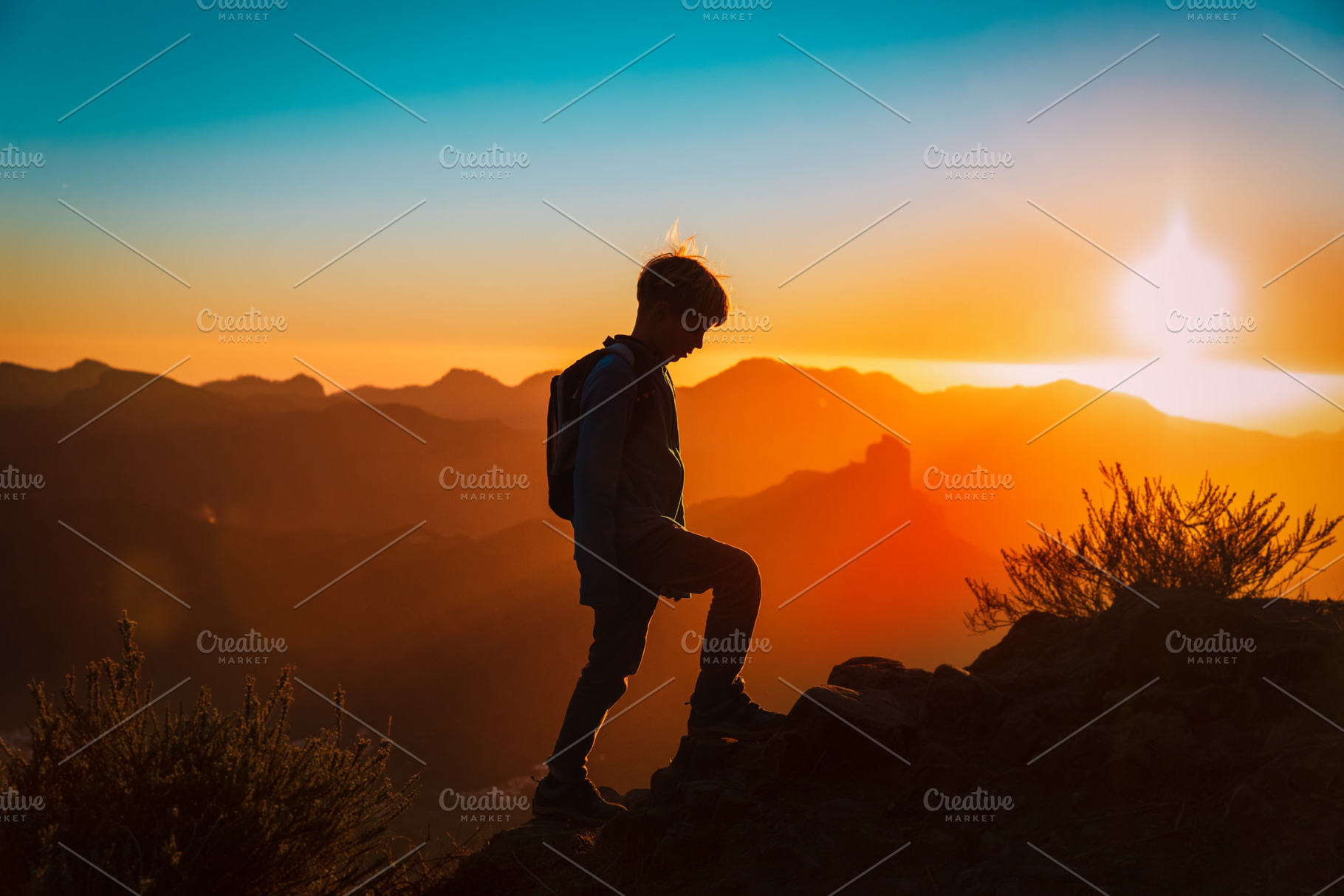 child in sunset mountains, a Person Photo by Nadezhda_Prokudina