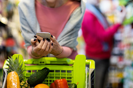 Unrecognizable customers man and woman doing grocery in supermarket, cropped, a Person Photo by Prostock-Studio