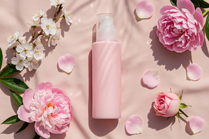 Pink cosmetic pump bottle with flowe, a Beauty & Fashion Photo by professorinc