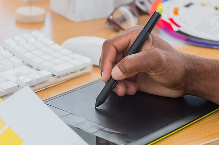 Interior designer with graphics tablet and colour chart, a Photo by wavebreak