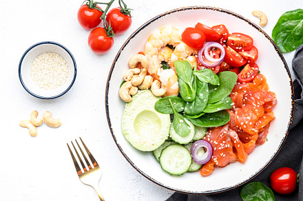 Keto salad with spinach, salmon, shrimp, avocado, cucumber, toma, a Food & Drink Photo by 5PH