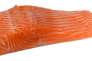 Fresh salmon fillet with bright orange color and pronounced fat, a Food & Drink Photo by ndanko