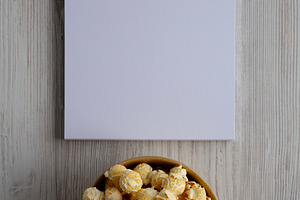 Homemade Butter Popcorn with Sea Salt in a Bowl, Blank Notepad,, a Food & Drink Photo by LiudmylaChuhunova
