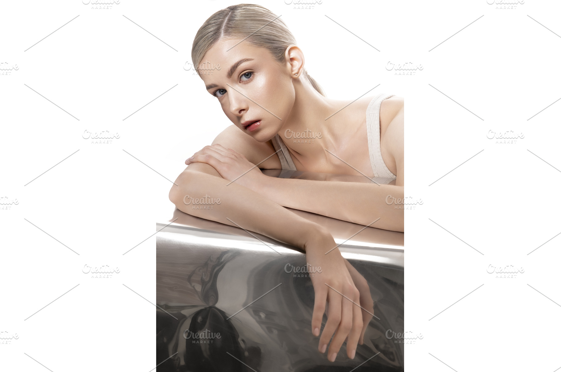 A woman is lying on a table with her, a Beauty & Fashion Photo by korabkova