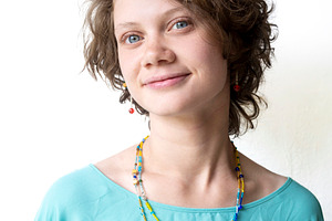 A close-up portrait of the same youn, a Person Photo by Imaginarium