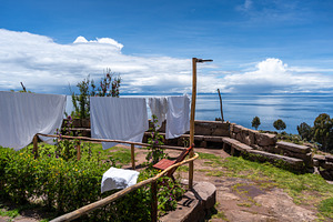 Laundry drying under the sun on Taquile Island, Lake Titicaca, P, an Architecture Photo by GoodGoods