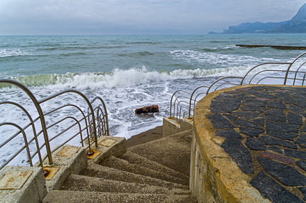 Staircase descending to the sandy beach.