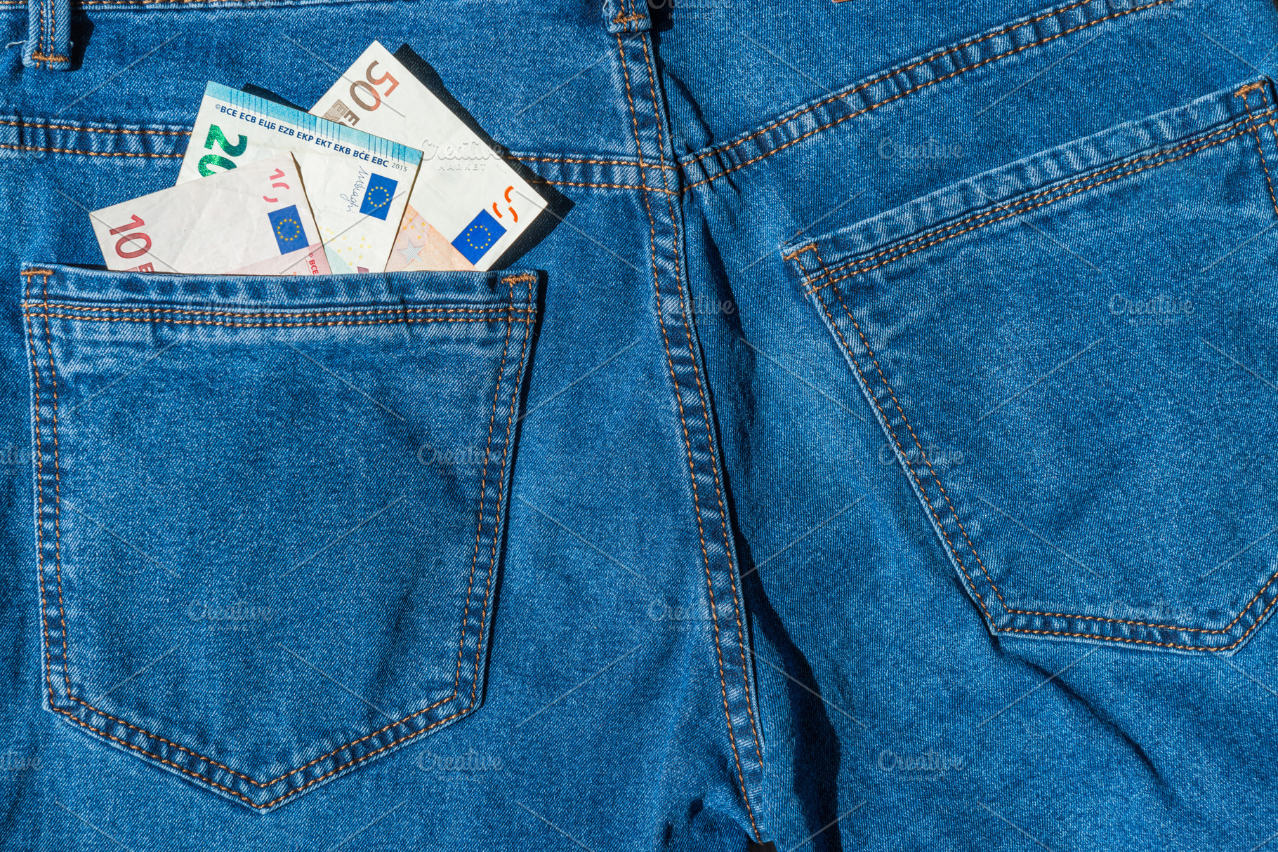 Money in blue jeans pocket, a Business Photo by Vapi