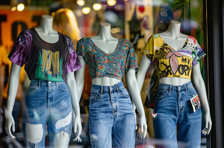 Two mannequins dressed in graphic te, a Photo by Iftikhar Alam