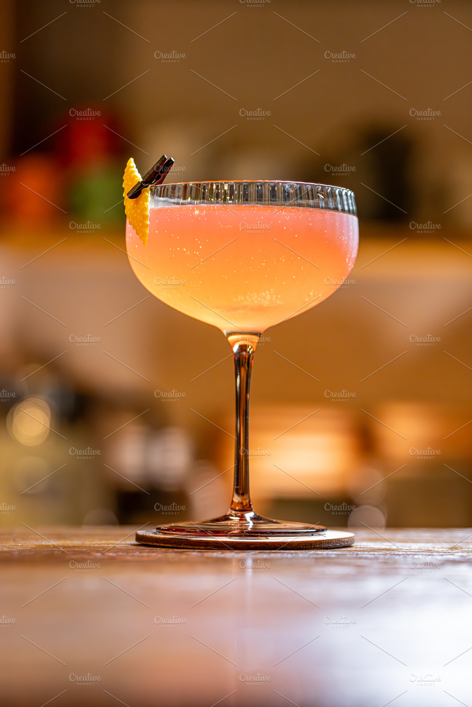 Pink cocktail served in a coupe glass, a Photo by Grafvision photography