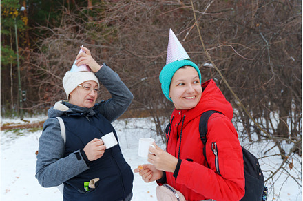 Friends savor the joy of winter in a