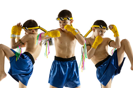 Little boy exercising thai boxing on white background. Fighter practicing, trai, a Sports & Recreation Photo by Volodymyr Melnyk