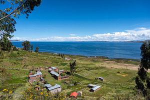 Scenic view of Lake Titicaca from Llachon with rural houses, a Nature Photo by GoodGoods