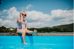 Little girl enjoying summer by the