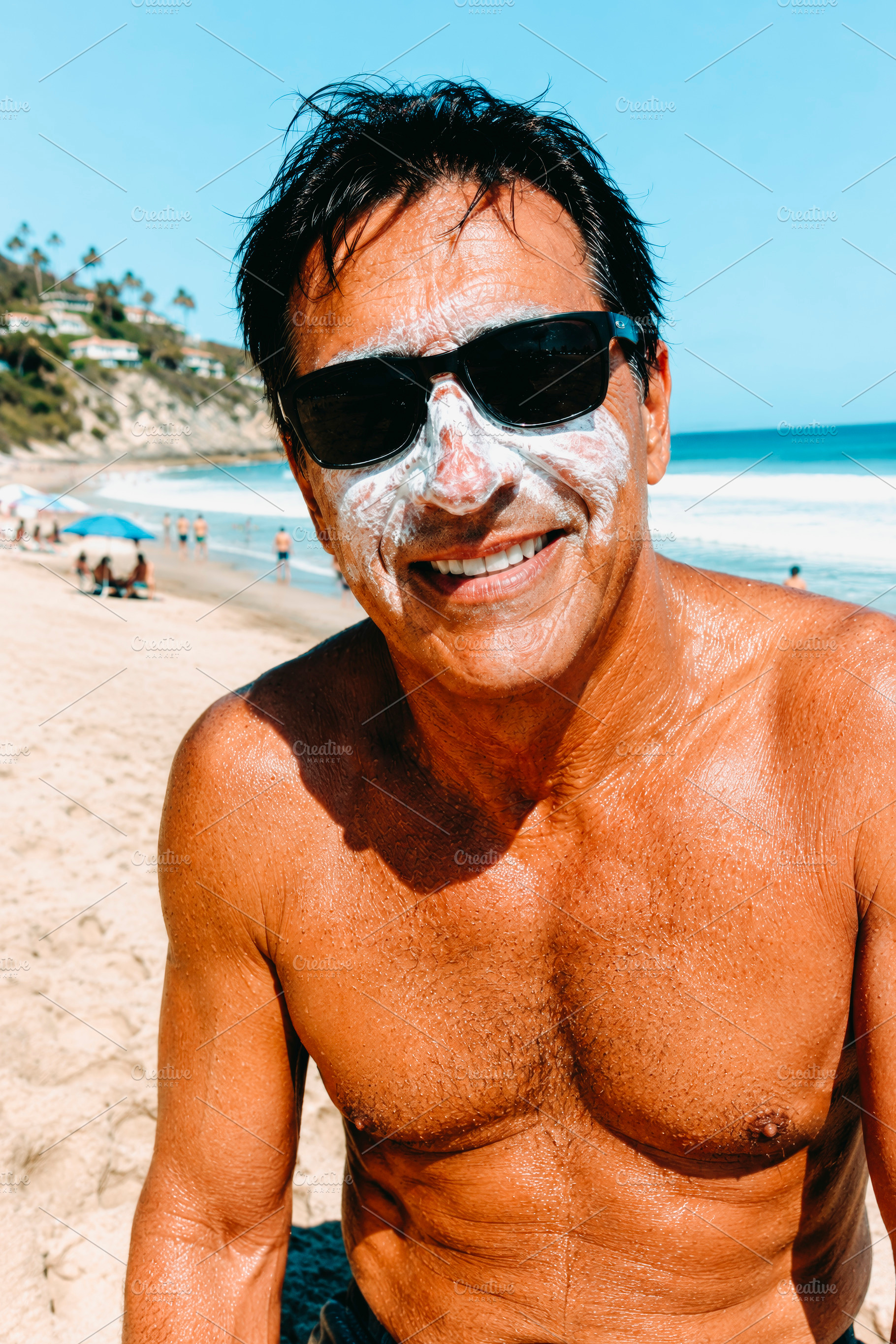 a man wears sunscreen on a beach, generative AI, a Photo by Nito