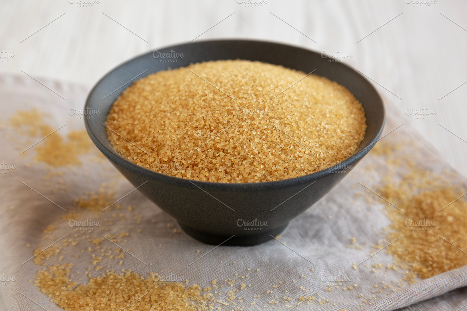 Organic Demerara Sugar in a Bowl, side view. Close-up., a Food & Drink Photo by LiudmylaChuhunova