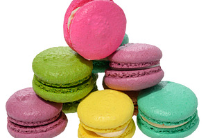 An assortment of colorful macarons, isolated background, a Food & Drink Photo by ndanko