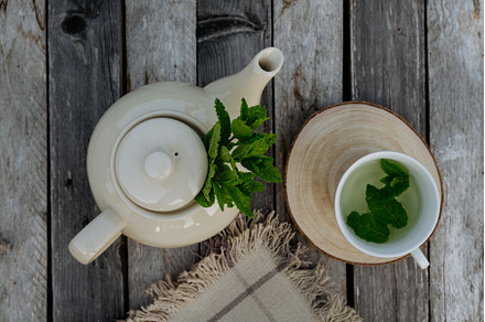 Top view of a teapot and tea cup, a Food & Drink Photo by HalfPoint
